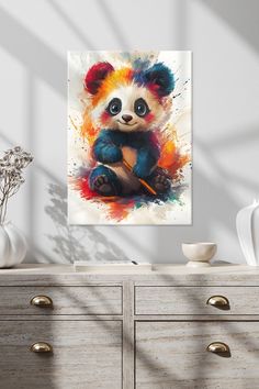 a painting of a panda bear sitting on top of a dresser