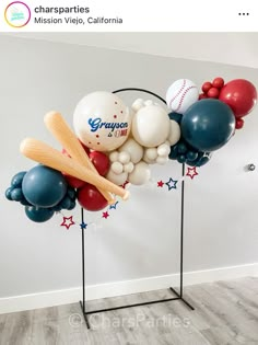 balloons and baseballs are on display in this room with a sign that says congratulations