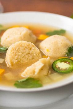 a white bowl filled with soup on top of a table