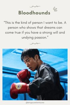 a man in black jacket and red boxing gloves