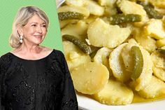 an older woman standing in front of a plate of pasta and pickles on a green background