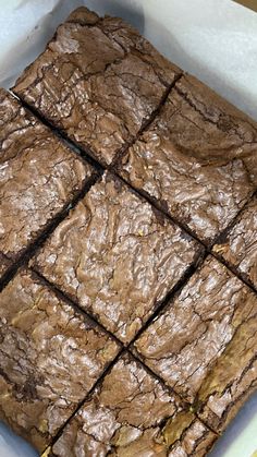 some brownies in a white bowl on a table