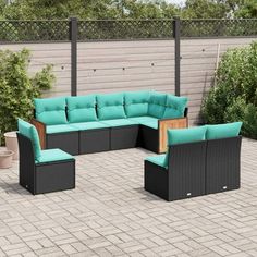 an outdoor patio furniture set with blue cushions