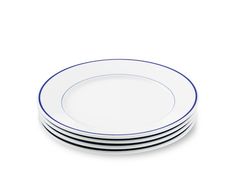 four white and blue plates stacked on top of each other