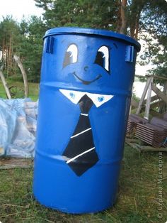 a blue barrel with a man's tie painted on it