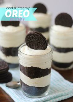 an oreo cookie sitting on top of a dessert in a jar