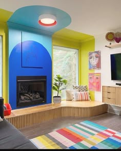 a living room with colorful walls and furniture