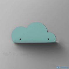 a blue cloud shaped shelf on a gray wall