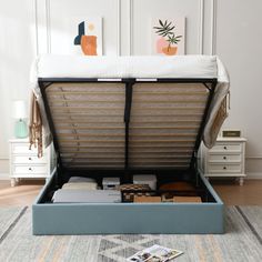 an open bed frame sitting on top of a rug