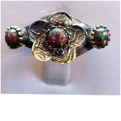 Genuine Black Boulder Fire Opals In A Sweet Flower Design! Outstanding Color Display In Each Opal! Set In 925 Stamped Sterling Silver. Please See All Pictures For More Detail And Measurementsml. Brand New. Never Worn. Wholesale Prices Always....Or Less Two Tone Ring, Fire Opals, Wedding Ring Sizes, Silver Spoons, Color Display, White Gold Band, Red Fire, Magpie, Opal Rings