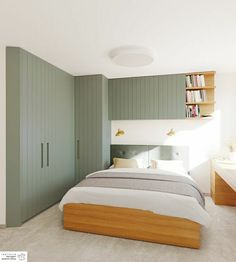 a bed sitting in a bedroom next to a green book shelf filled with lots of books