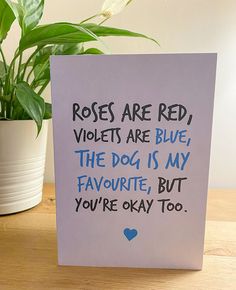 a card that says roses are red violets are blue the dog is my favorite, but you're okay to