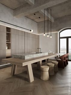 a large dining table with benches and stools in the middle of an open floor plan