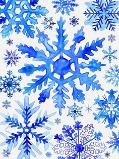 blue watercolor snowflakes on white paper