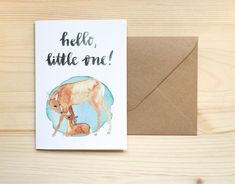 a greeting card with an illustration of a baby cow and its mother on the front