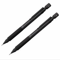 two black pens sitting next to each other