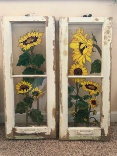 two old windows with sunflowers painted on them