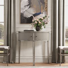 a painting hangs on the wall next to a console table with flowers in front of it