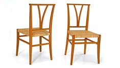 two wooden chairs sitting side by side against a white background, one has a woven seat and the other has a wicker back