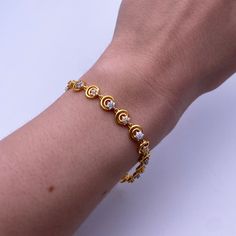 22ct Yellow Gold & CZ Fancy Ladies Bracelet 7.5 inches 916 Metal : 22K Gold 916 Gold Weight : 9.3 GramsLength : 7.5 inch Width : 6.1 mm Packaging : Elegant Box Shipping Free in UKShipping World Wide : See PolicyPayment : PayPal, Credit Card, Bank TransferReturns Policy : 14 Days Hassle Free Returns for 100% Refund To try this item Or View More from our collectionsPlease Visit Our Showroom at North west London. Gold Jewels Design Bracelet, Gold Breclates Girl, Bracelet Gold Designs For Women, Bracelets Gold Simple For Women Indian, Women Gold Bracelet Designs, Ladies Bracelets Gold Design, Daily Wear Gold Bracelet For Women