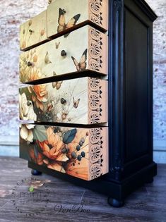 an old dresser is painted with butterflies and flowers on it's sides, as well as the drawers