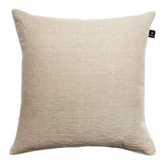 a white pillow with a black tag on the front and back of it, against a white background