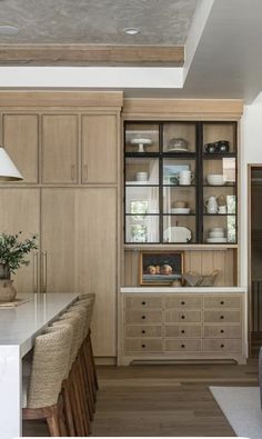 the kitchen is clean and ready to be used for dinner or breakfast time, as well as other things that are kept in the cupboards