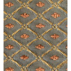 an upholstered fabric with gold and grey designs