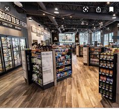 the inside of a grocery store with shelves full of food and drinks on display for purchase