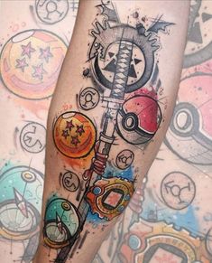 a person with a tattoo on their leg that has many different things on it and is holding