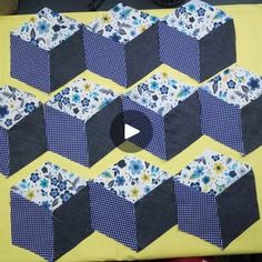 a video demonstrating how to make a hexagonal quilt block with squares and flowers