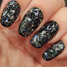 Shattered is an all silver ultra holographic topper 💎 It is full of ultra holographic micro flakes, shreds, and shards. The effect over a black or dark base is mesmerizing! Swatches are one coat over Holo Taco One Coat Black and topped with Essie Gel Setter top coat. This listing is for One full sized nail polish (0.5 oz/15 ml). All my polishes are 5 free and cruelty free.  There is a full ingredients list in my policies section.  I do not use any commercial  products or polishes in my bottles. I hand mix every bottle myself so there will be some slight variations from bottle to bottle. All bottles come with 2 stainless steel mixing balls.  I recommend using a base coat and a top coat to provide shine and longevity to your manicure! I will try to ship all items within 3-5 business days, b Essie Gel Setter Top Coat, Holo Taco, Essie Gel, Ingredients List, Loose Glitter, Nail Polishes, Coat Black, Base Coat, Top Coat