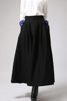 Fluidity and elegance from this chic long maxi autumn winter skirt, Craft with wool fabric, featuring elegant pleated detail waist, Team this long skirt  with a chunky sweater, winter boots and an oversized handbag and you're good to go, no matter what the weather throws at you! DETAILS:* Buy Now at Etsy* 30% wool, 30% fiber, 40% polyester* polyester lining* Fitted waist* Seam pockets* Side Zip closure* Ankle length* Dry Clean * Fast shipping service Provided❤ Handmade with Love, Unique and Chi Winter Wide-leg Solid Color Skirt, Winter Wide Leg Solid Color Skirt, Baggy Solid Skirt For Fall, Chic Fall Maxi Skirt, Winter Midi Skirt In Solid Color, Chic Full-length Solid Color Skirt, Chic Winter Workwear Maxi Skirt, Chic Maxi Skirt For Fall, Elegant Fall Skirt With Wide Hem