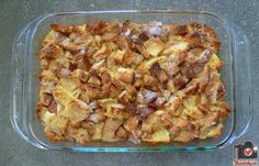 a glass casserole dish filled with bread and pudding