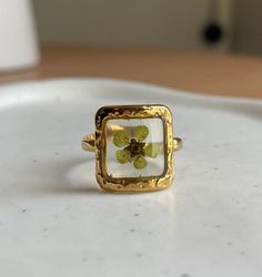 Beautiful Green Pressed Flower Square Ring Adjustable  18k Gold Plated Adjustable Gold Flower Ring, Delicate Flower-shaped Gold Ring, Delicate Gold Flower Ring, Yellow Flower Ring For Anniversary, Gold Flower Shaped Promise Ring, Nature-inspired Gold Flower Ring With Birth Flower, Nature-inspired Gold Birth Flower Ring, Gold Flower Ring Nature-inspired, Handmade Gold Flower Ring Nature-inspired