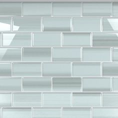 a white tile wall that has been made from glass bricks and is being used as a background