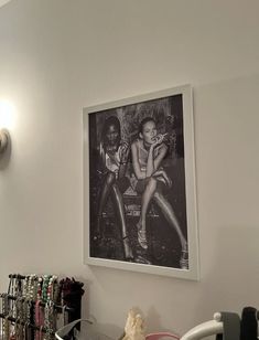 there is a black and white photo hanging on the wall