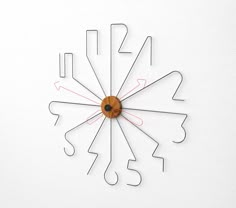 a clock that is on the wall with numbers and lines in it's face