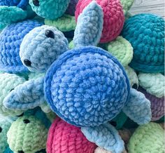 a pile of crocheted stuffed animals sitting on top of each other