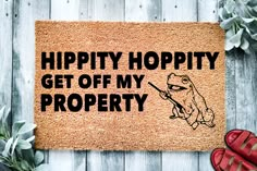 a door mat that says, hippity hoppy get off my property