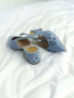 Wedding slingback pumps 'Tati' are handcrafted from something blue Italian suede. The pair of bridal heels features handmade floral embroidery with wildflowers and vines that can be customized to your preference.  This design also has pointy toes and 5.5 cm / 2.2 inches stable block heels that are also embroidered in the same pattern. These wedding shoes are designed with a V-notched vamp (v-cut) and closed toe which makes bridal sandals even more elegant and special. Take note that the base of Blue Bridal Shoes Low Heel, Blue Open Heel Wedding Shoes, Wildflower Embroidery, Stable Block, Wedding Pumps, Shoes Socks, Bridal Sandals, Bridal Heels, Blue Pumps