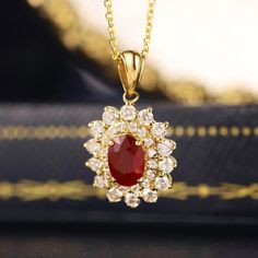 Make A Lasting Impression With Our Breathtaking Lab Grown Diamond And Ruby Halo Pendant Necklace, Made From 18k Yellow Gold Elegant Yellow Gold Ruby Necklace, Exquisite Round Ruby Necklaces, Exquisite Gold Oval Diamond Necklace, Dazzling Gold Diamond Necklace With Gemstone, Gold Diamond Necklace With Gemstone Pendant, Gold Diamond Pendant Necklace With Gemstone, Traditional Yellow Gold Diamond Necklace Gift, Yellow Gold Ruby Oval Pendant Jewelry, Yellow Gold Ruby Oval Pendant