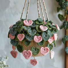 a potted plant with hearts hanging from it