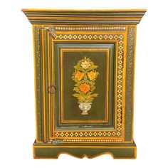 an ornate painted cabinet with flowers on it