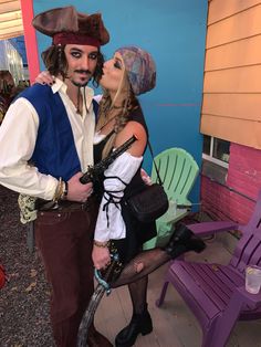 a man and woman dressed up as pirates