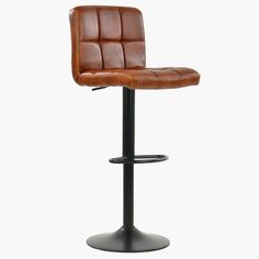 a brown leather bar stool sitting on top of a metal base