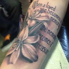 a person with a tattoo on their arm that says when a loved someone becomes a memory