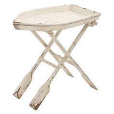 an old wooden tray with two crossed legs and a handle on the side, sitting on a white background