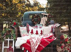 an old truck with christmas decorations on the bed