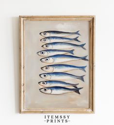 a painting of fish in a wooden frame on the wall above it is an inscription that reads intensity prints